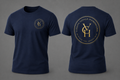 A navy blue short-sleeve t-shirt shown from both the front and back against a neutral gray background. The front features a small circular gold logo on the left chest, and the back features a large circular gold logo with the initials 'VGH' and the text 'VISION GOALS HARDWORK' and 'ACHIEVE THE IMPOSSIBLE'.
